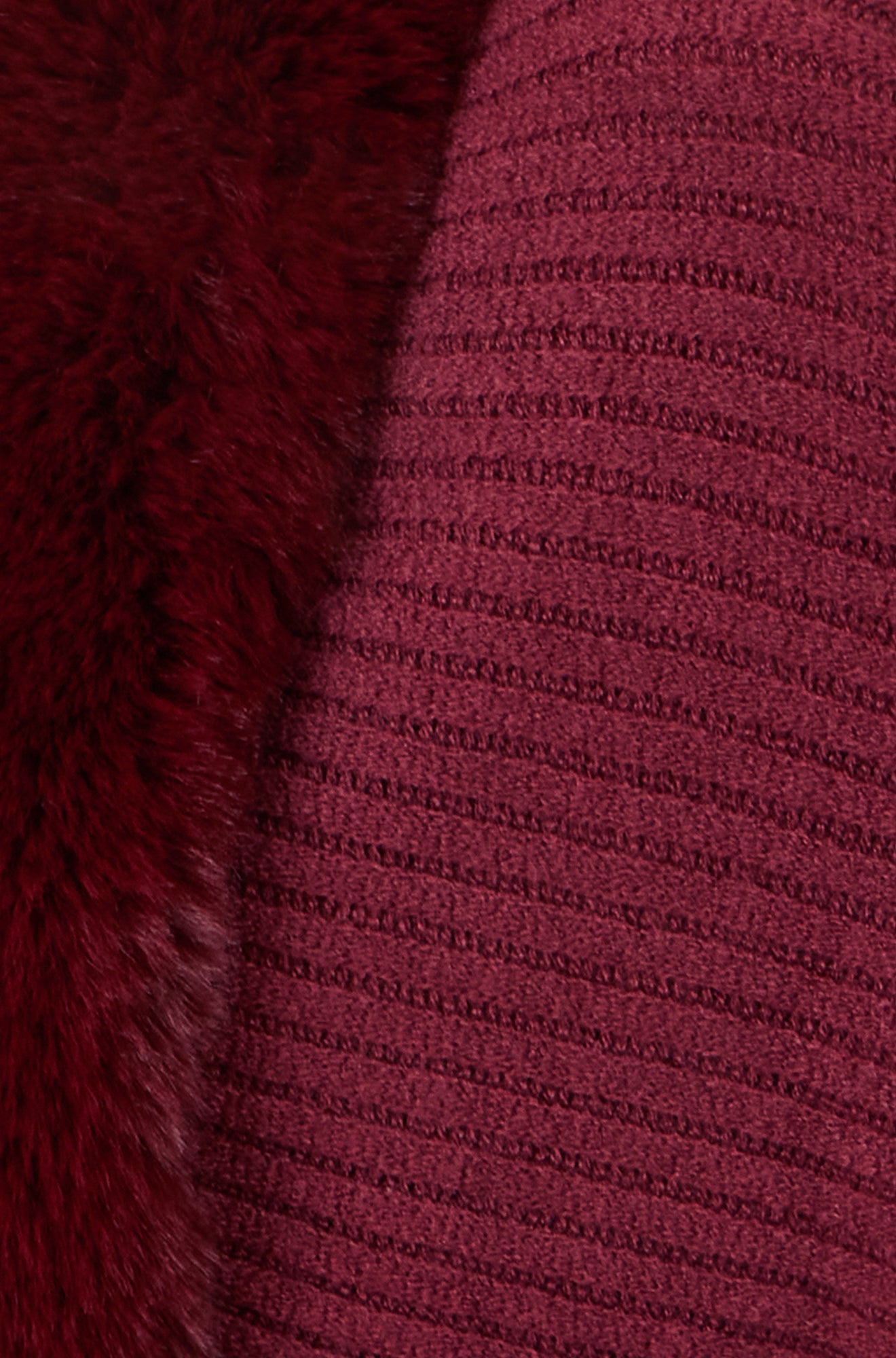 Close-up of a textured purple fabric with a subtle pattern