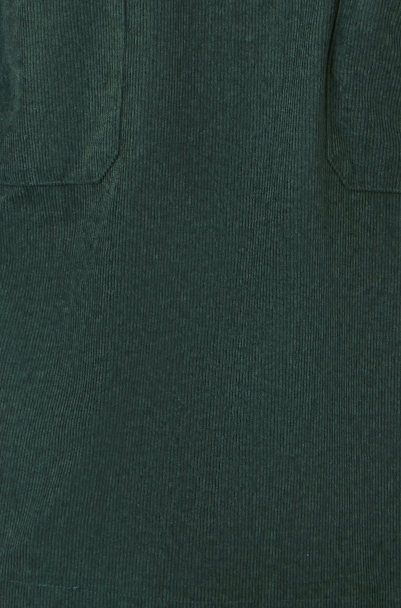 Close-up of a dark green fabric texture with two pocket openings.