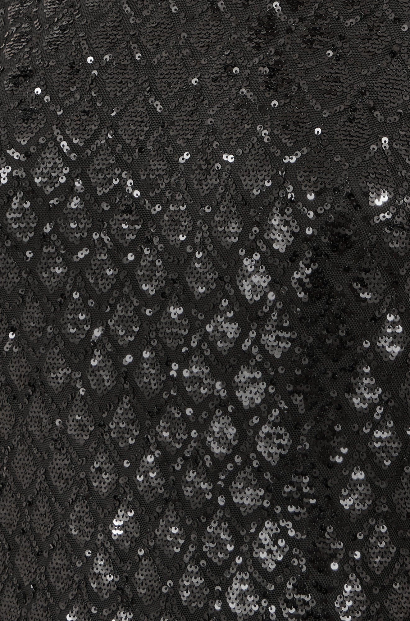 Close-up of black lace fabric with sequin embellishments